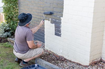 Professional Brick Painter at Work